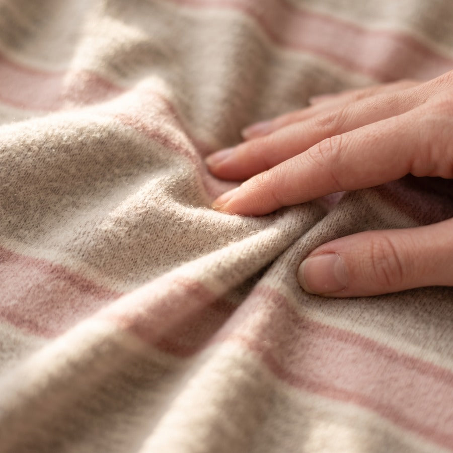 Close-up of the brushed striped knit in Pink